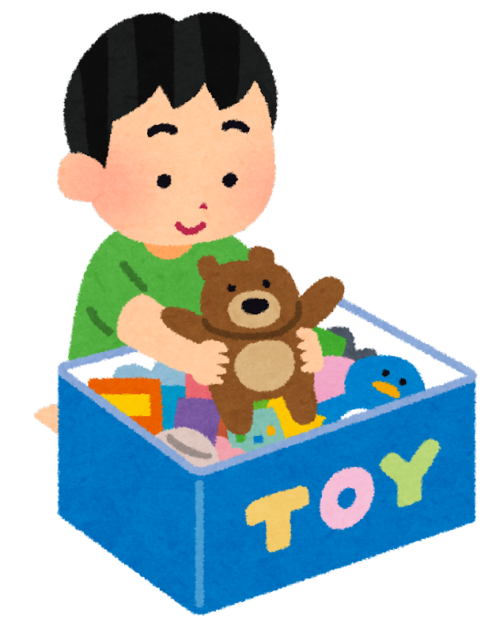 おもちゃのボックスからおもちゃを取り出す男の子